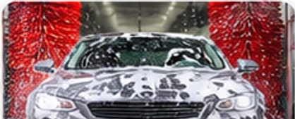 Foamed vehicle in an auto wash bay